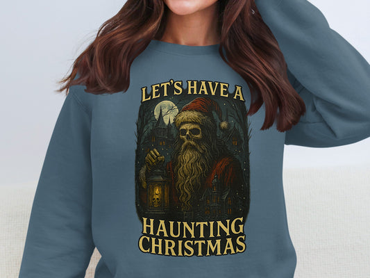Indigo blue gothic sweatshirt featuring skull Santa and lantern artwork, dark holiday festive Christmas design.